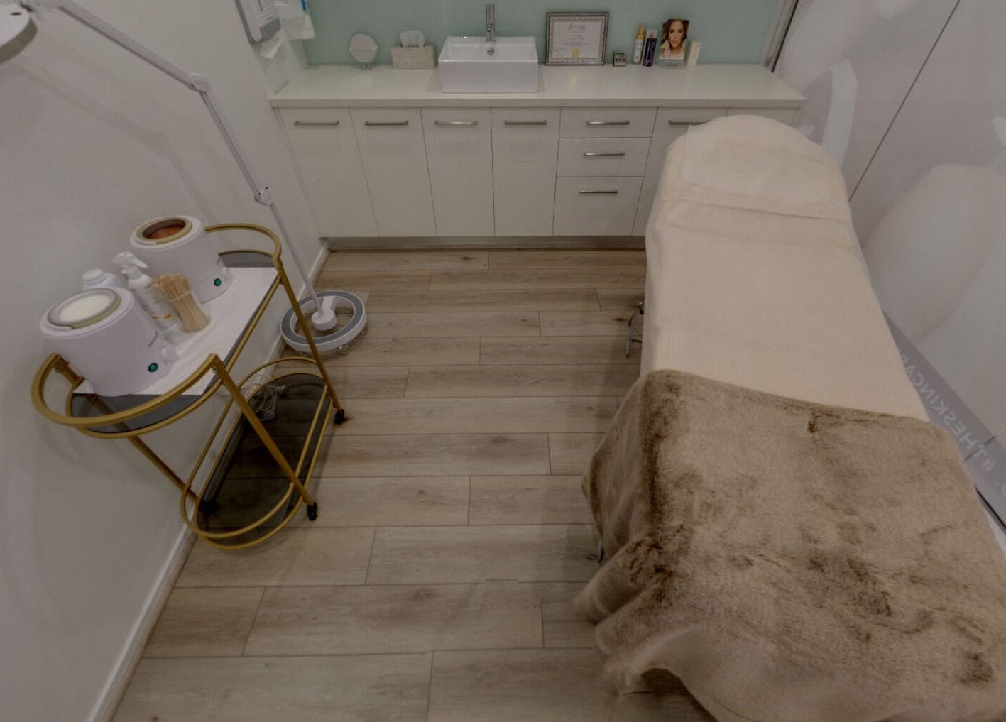 Serene treatment room at Skin and Laser Studio, St Leonards, New South Wales, AU, featuring a cozy bed.