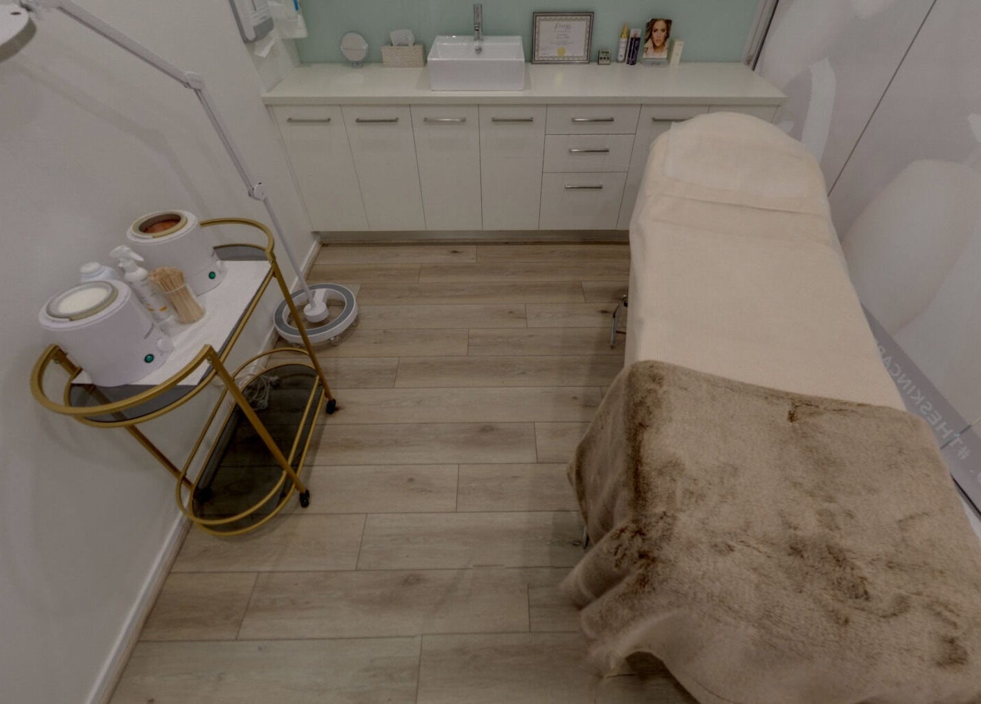 Serene treatment room at Skin and Laser Studio, St Leonards, New South Wales, AU, featuring a cozy bed.