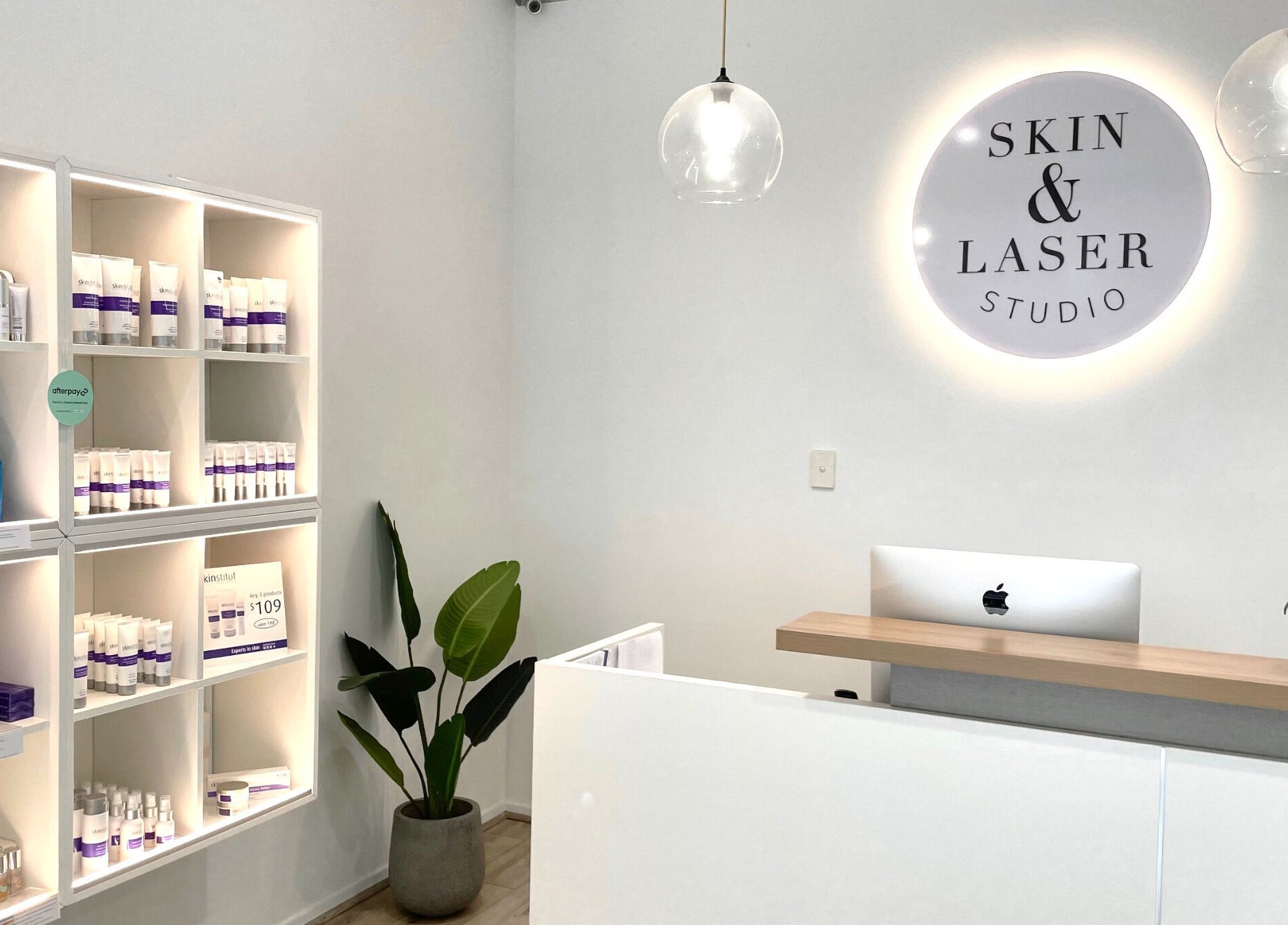 Inviting reception area at Skin and Laser Studio, St Leonards, New South Wales, AU with sleek decor and skincare products.