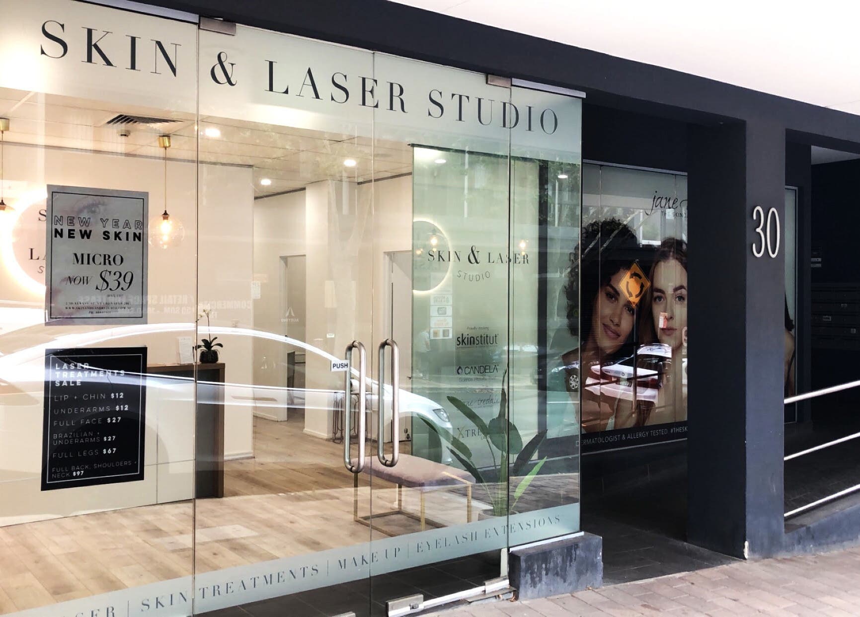 Entrance of Skin and Laser Studio in St Leonards, New South Wales, AU with modern glass doors.