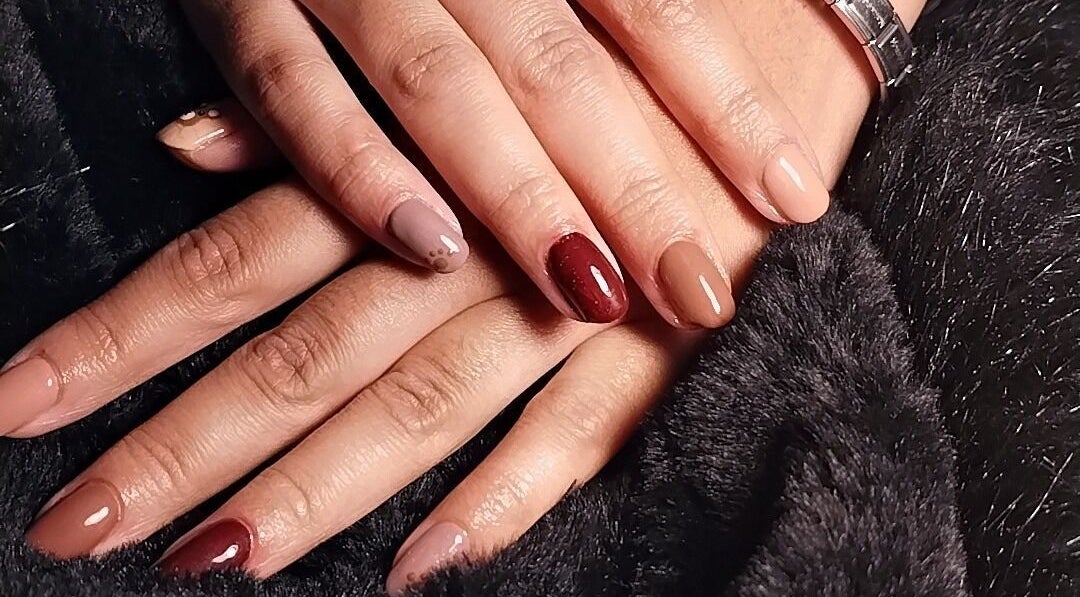 Elegant nail art by Nails By Courtney in Cape Town, Western Cape, ZA showcasing diverse polish shades.