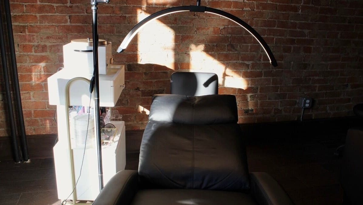 Modern esthetics treatment room at Orbit Esthetics in Covington, Kentucky, US with sleek design.