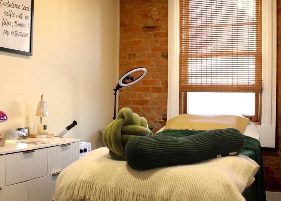 Relaxing spa room at Orbit Esthetics in Covington, Kentucky, US with soothing decor and ambient lighting.
