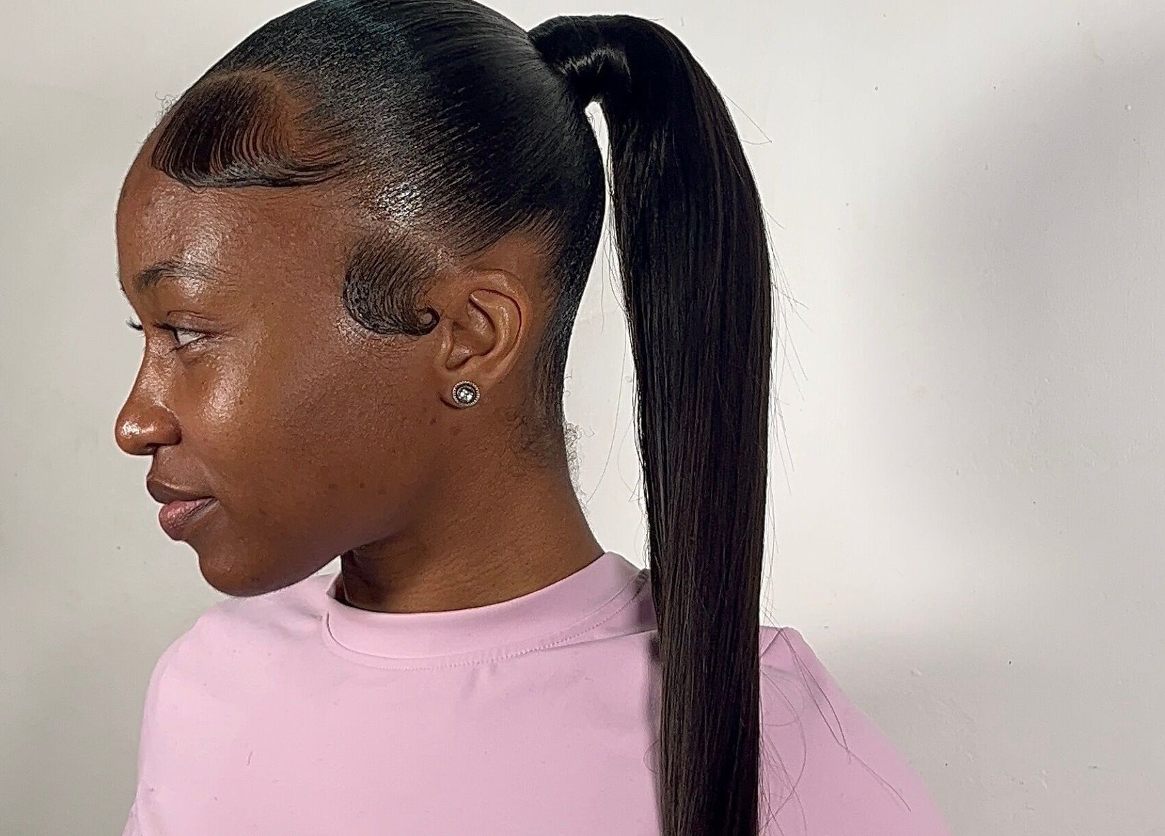 Sleek ponytail hairstyle at Milano Stylez, Oistins, Christ Church, BB, showcasing modern elegance.