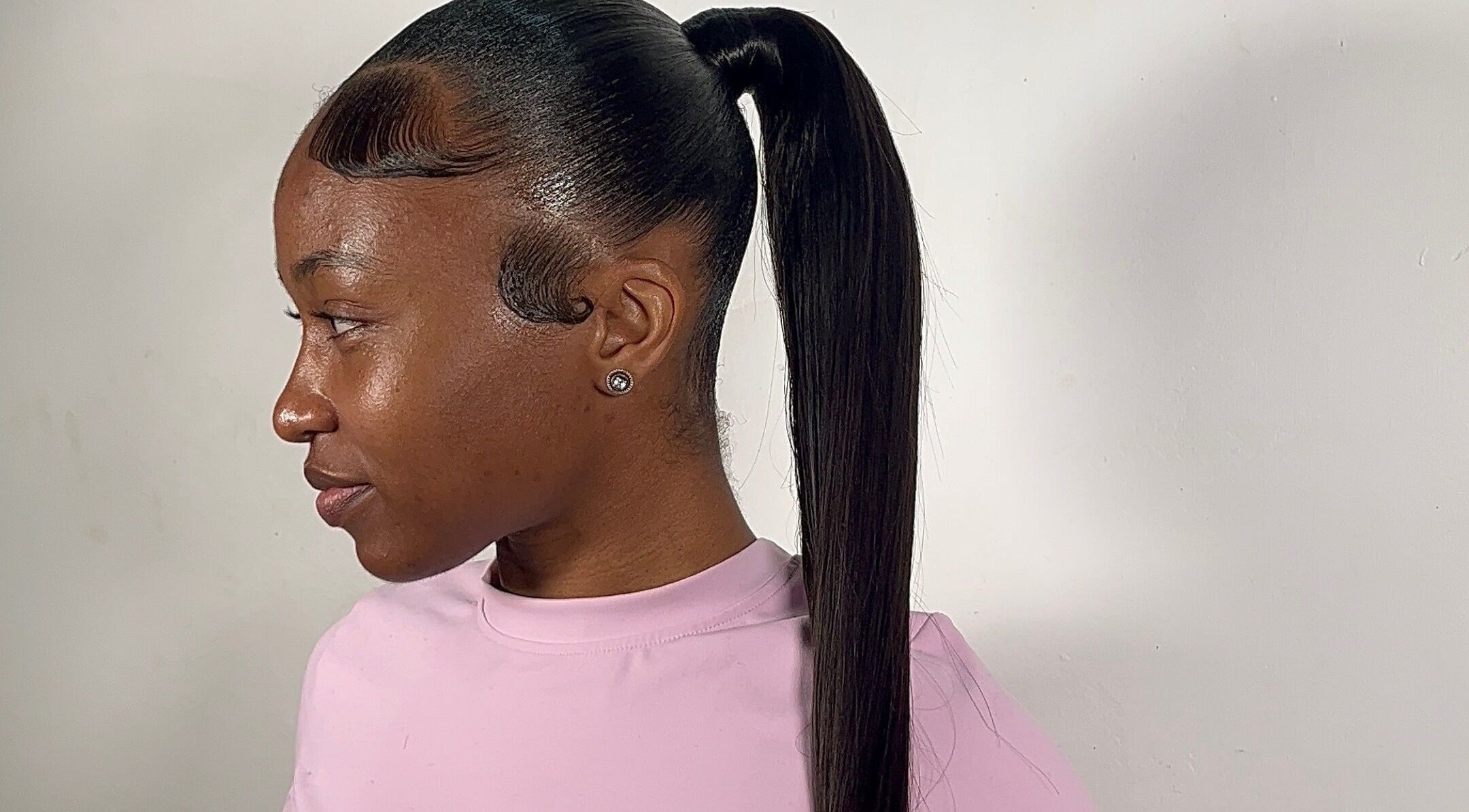 Sleek ponytail hairstyle at Milano Stylez, Oistins, Christ Church, BB, showcasing modern elegance.