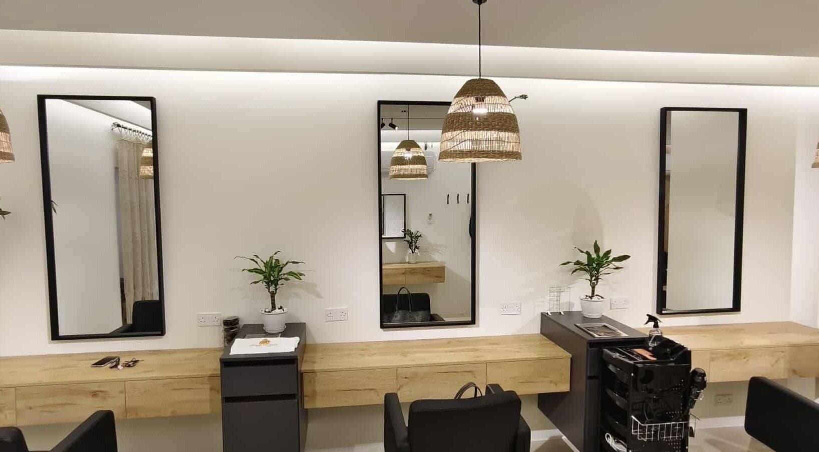 Modern salon station at Sisters Retreat Salon and Spa, Doha Municipality, QA showcasing stylish decor.
