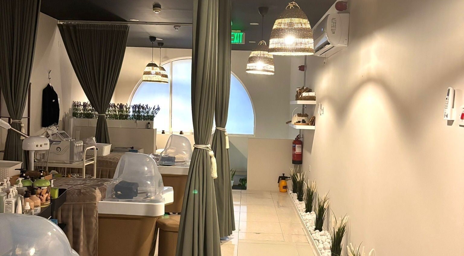 Relaxing interior of Sisters Retreat Salon and Spa, Doha, Doha Municipality, QA with serene lighting and decor.