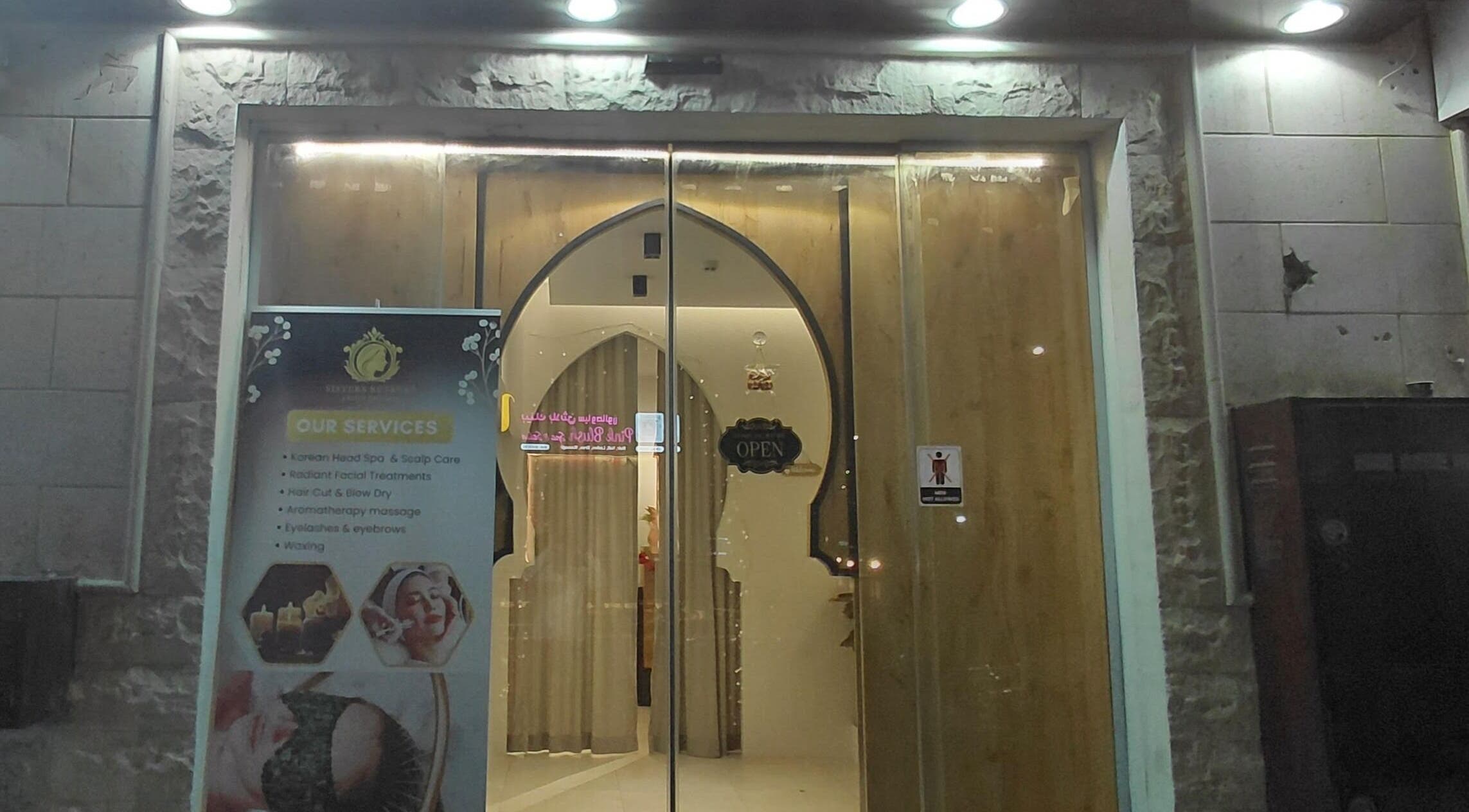 Entrance of Sisters Retreat Salon and Spa in Doha, Doha Municipality, QA showcasing available services.