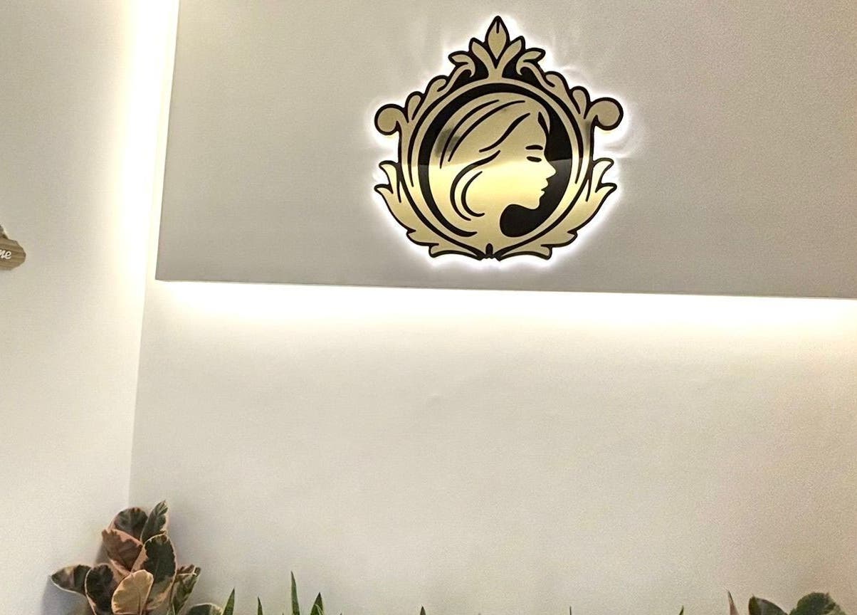Elegant logo at Sisters Retreat Salon and Spa, Doha, Doha Municipality, QA, welcoming clients in stylish comfort.