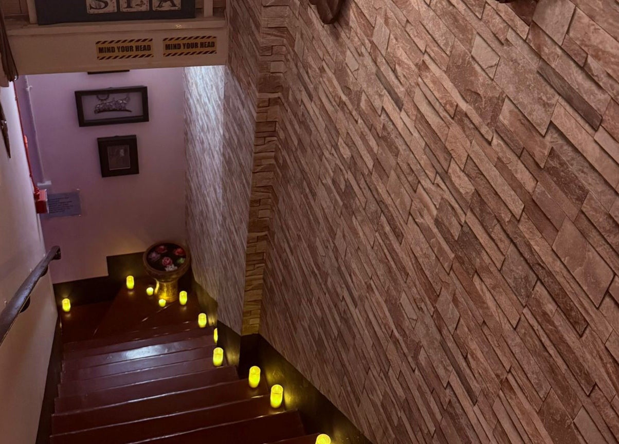 Candlelit stairs at Nisa Thai Spa near Buckingham Palace & Victoria Station, London, England.