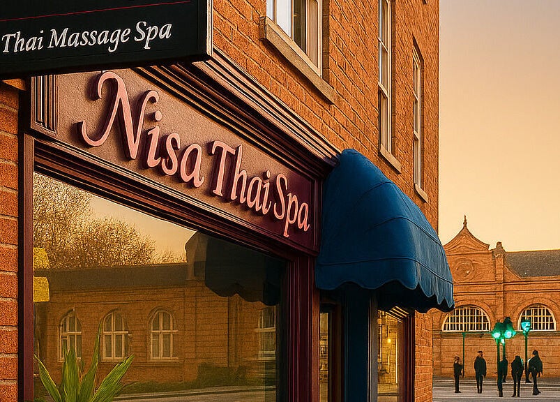 Nisa Thai Spa exterior near Buckingham Palace & Victoria Station, London, England, GB, with brick facade at sunset.
