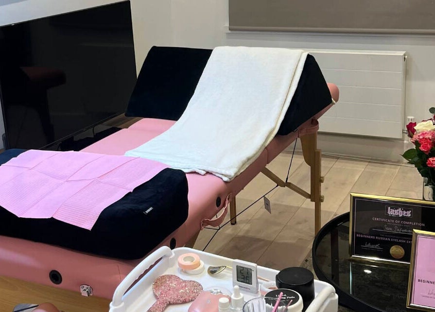 Relaxing treatment room at Sara’s Beauty Bar in Isleworth, England, GB, featuring a massage table and decor.