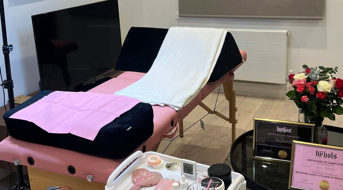 Relaxing treatment room at Sara’s Beauty Bar in Isleworth, England, GB, featuring a massage table and decor.