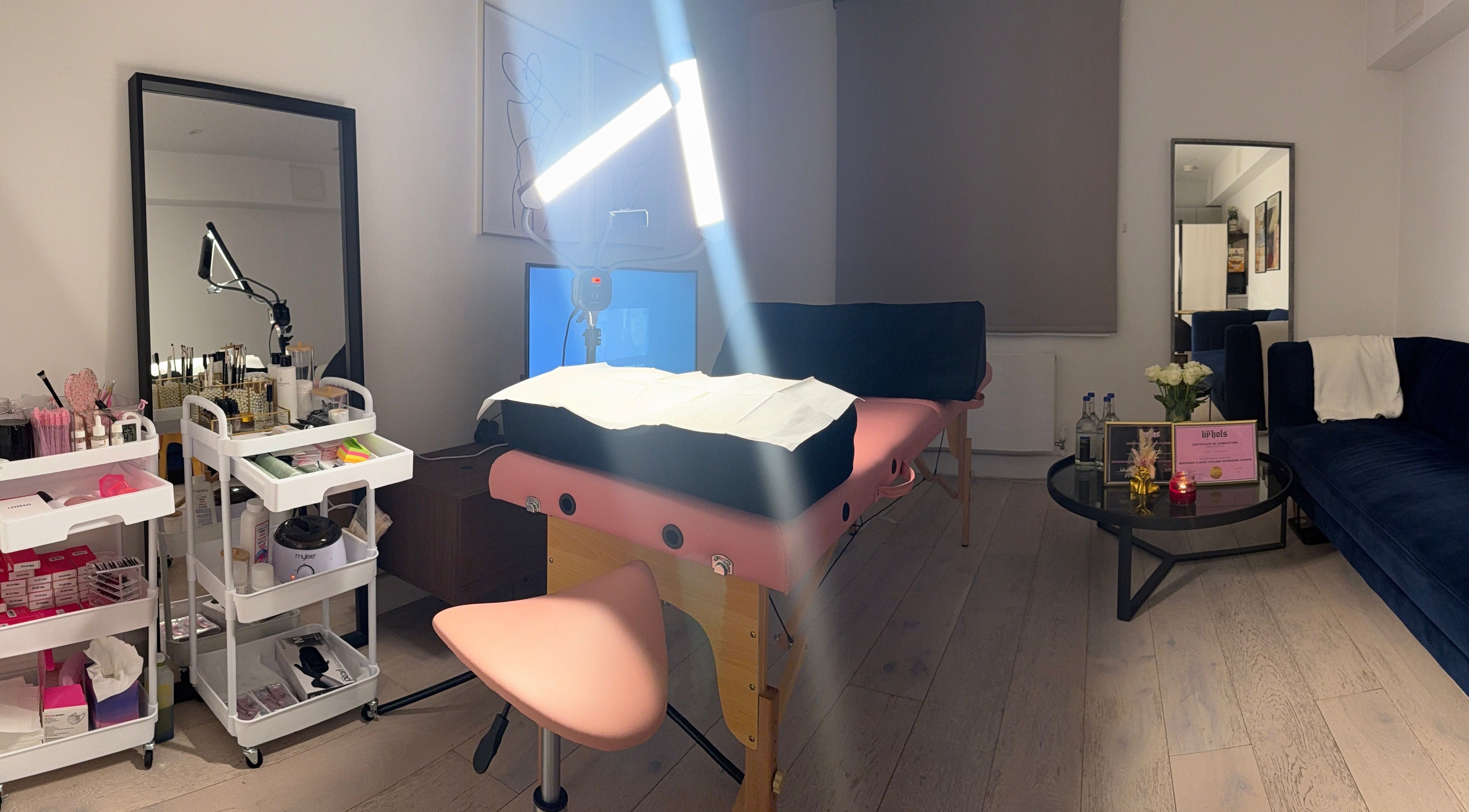 Cozy treatment space at Sara’s Beauty Bar, Isleworth, England, GB, featuring massage bed and beauty products.