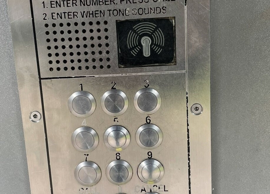 Security keypad at entrance of BeautiForAll Studio, Manchester, England, GB for visitor access.