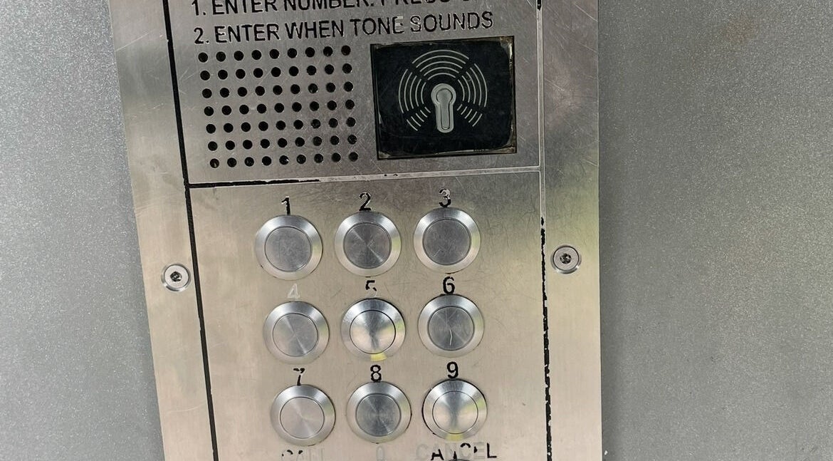 Security keypad at entrance of BeautiForAll Studio, Manchester, England, GB for visitor access.