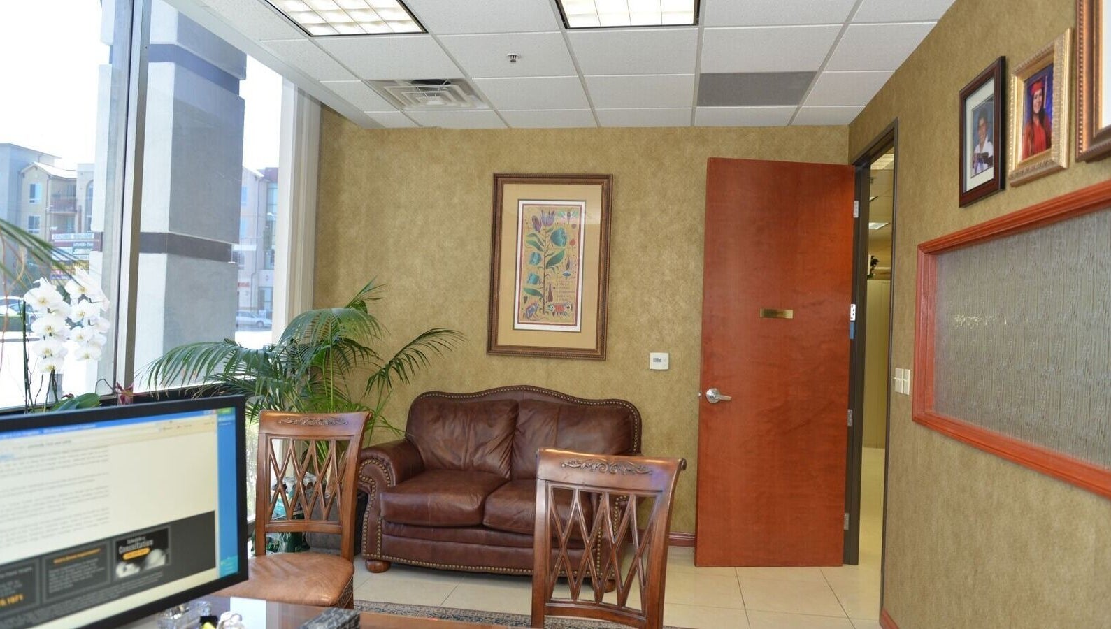 KESALZ LLC inviting lounge area in San Jose, California, US with leather seating and decorative plants.