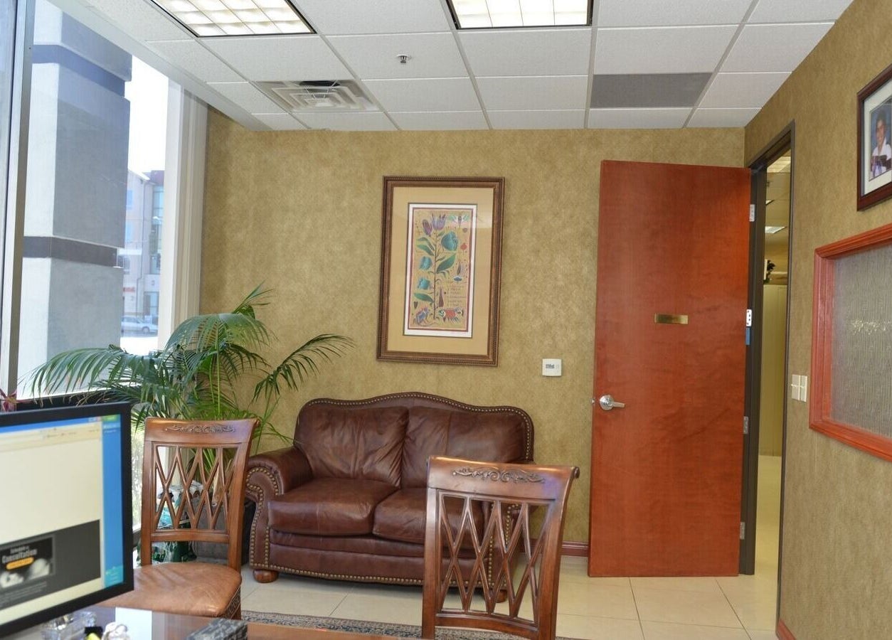 KESALZ LLC inviting lounge area in San Jose, California, US with leather seating and decorative plants.