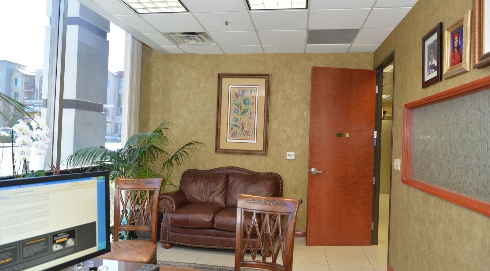 KESALZ LLC inviting lounge area in San Jose, California, US with leather seating and decorative plants.