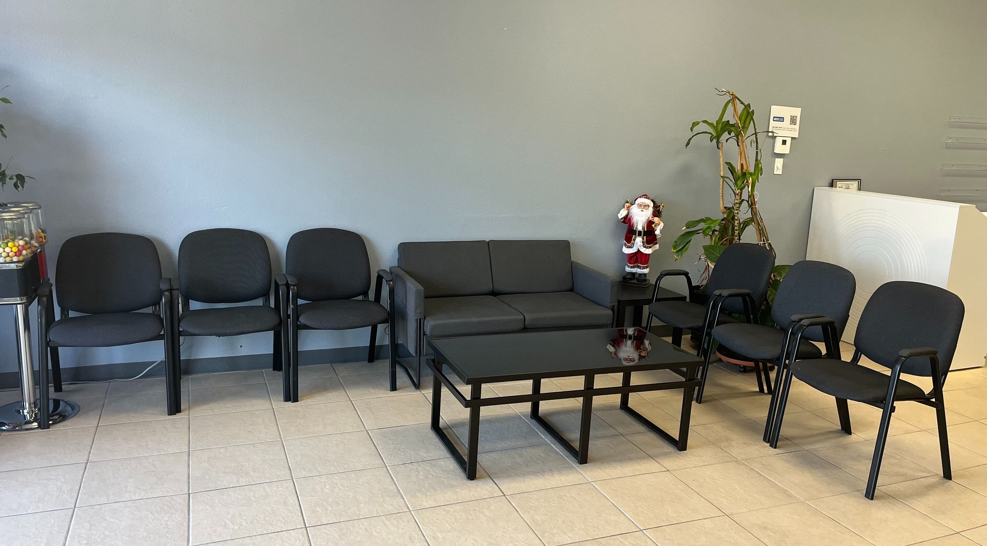 Modern waiting area at BEST CUTS, Wildomar, California, US, with seating and decor.
