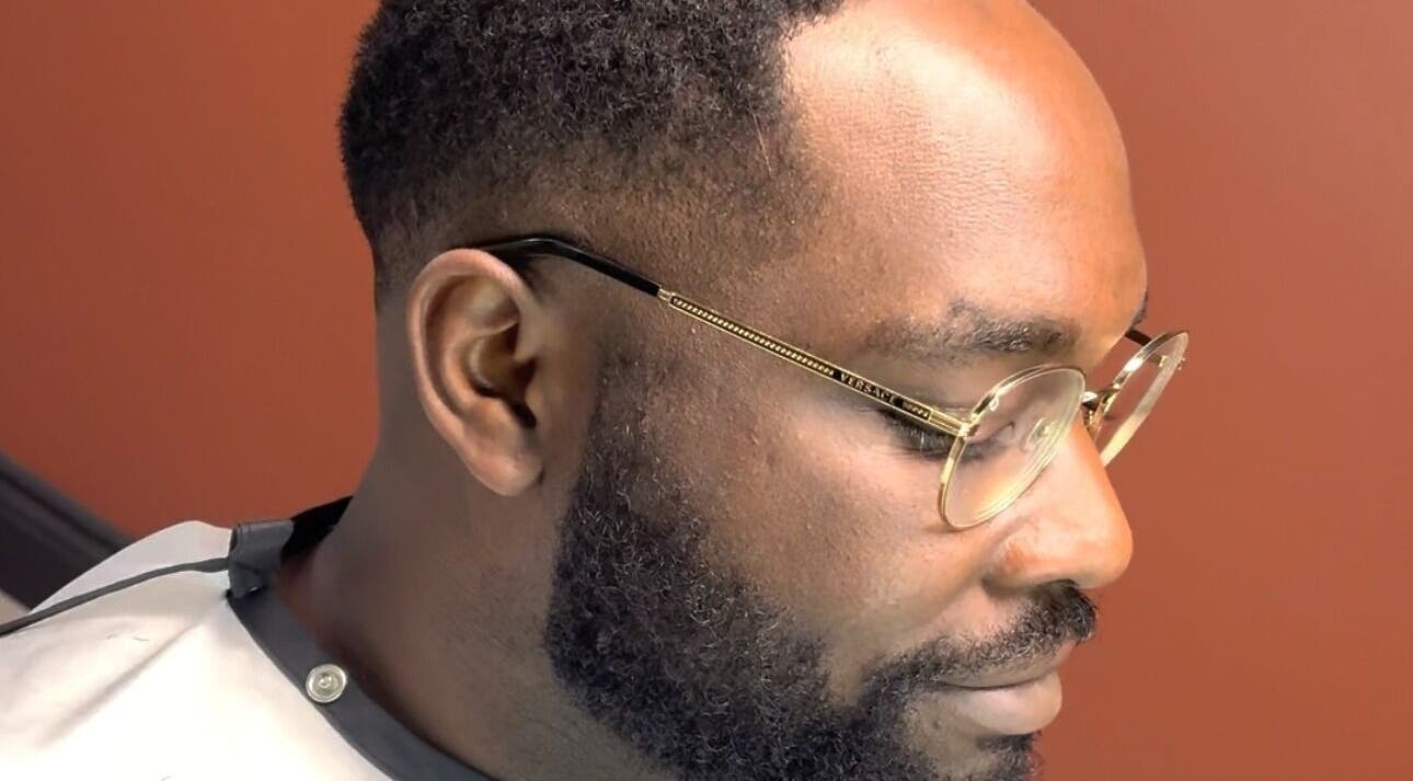 Man with trimmed beard and glasses at Velor Studio in Waterloo, Ontario, CA.
