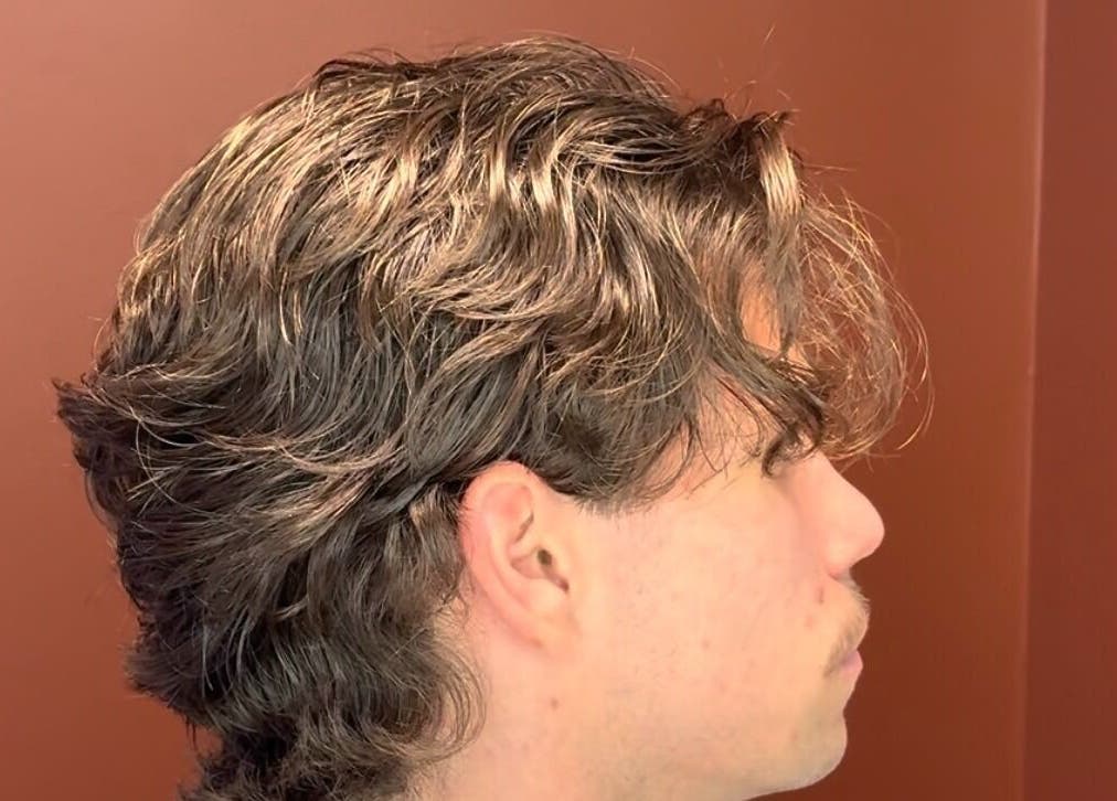 Side profile of a man with stylish wavy hair at Velor Studio in Waterloo, Ontario, CA.