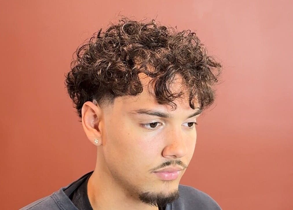 Modern curly haircut at Velor Studio, Waterloo, Ontario, CA.