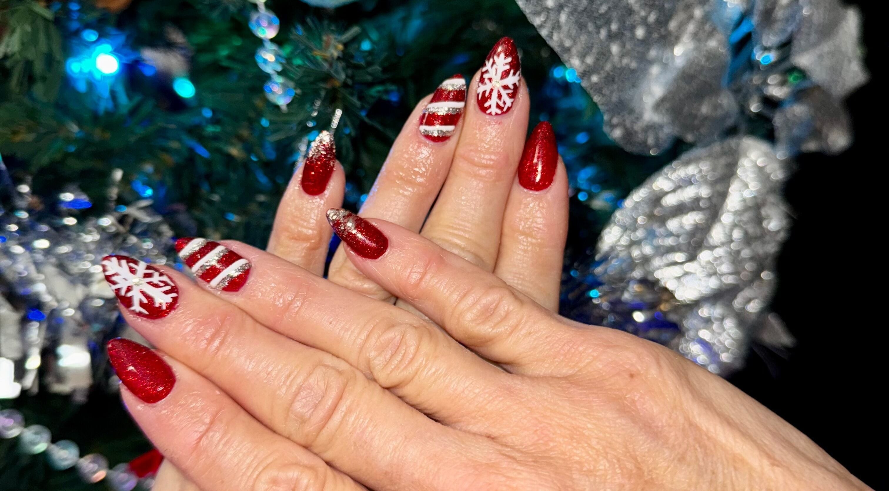 Festive red and white nail art at The Cass Effect, Deland, Florida, US, perfect for holiday celebrations.