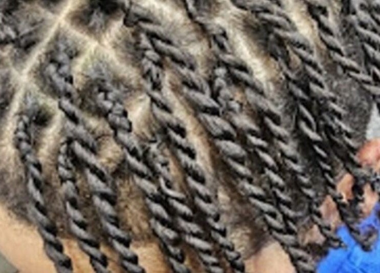 Intricate twist braids styled at Priceless Hair and Beauty in Slough, England, GB.