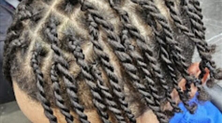 Intricate twist braids styled at Priceless Hair and Beauty in Slough, England, GB.