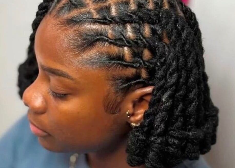 Stylish braided hairstyle at Venus hair and beauty, Northolt, England, GB. Perfect choice for a trendy look.