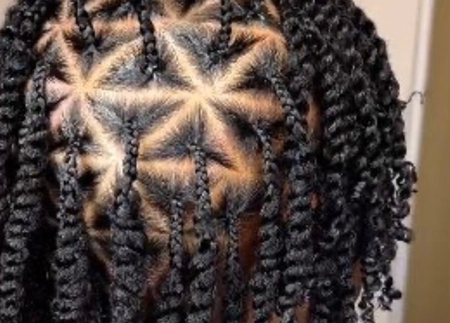 Intricate braided hairstyle showcased at Venus Hair and Beauty, Northolt, England, GB.