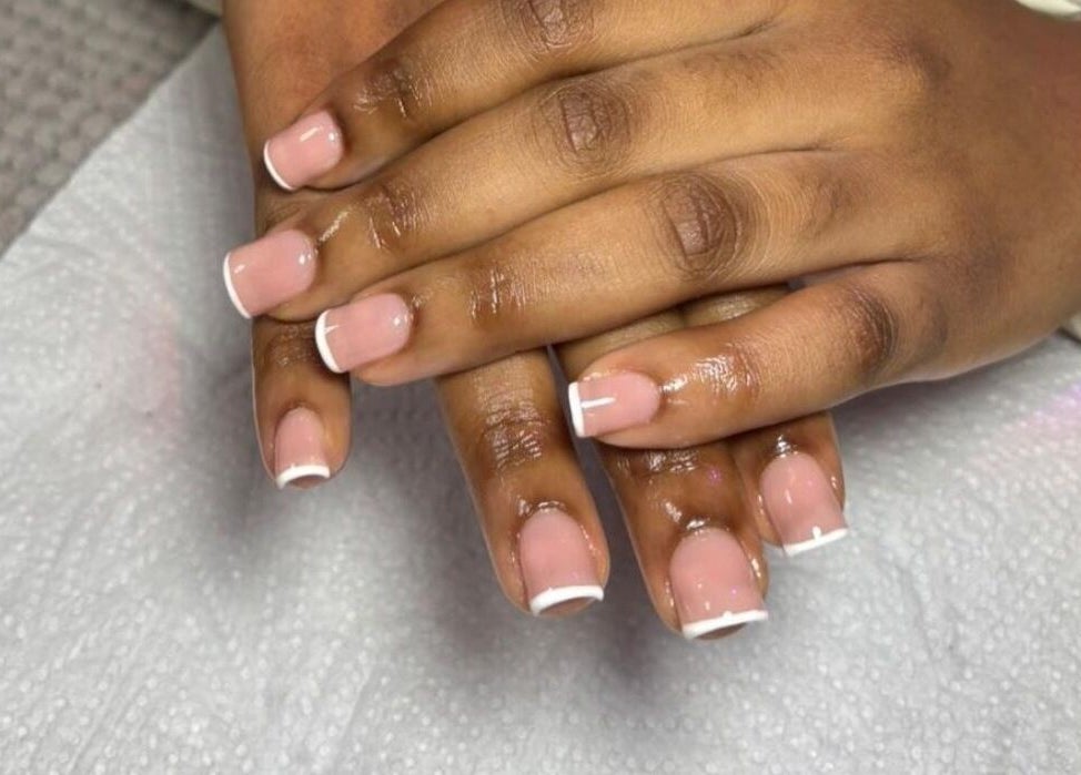Freshly manicured nails with French tips by Pure Glow Mani And Pedi Mobile, Cape Town, Western Cape, ZA.