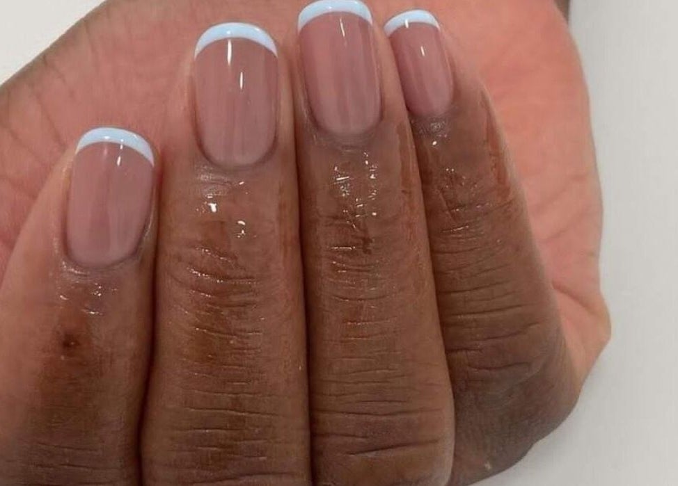 Stylish manicure with white tips at Pure Glow Mani And Pedi Mobile in Cape Town, Western Cape, ZA.