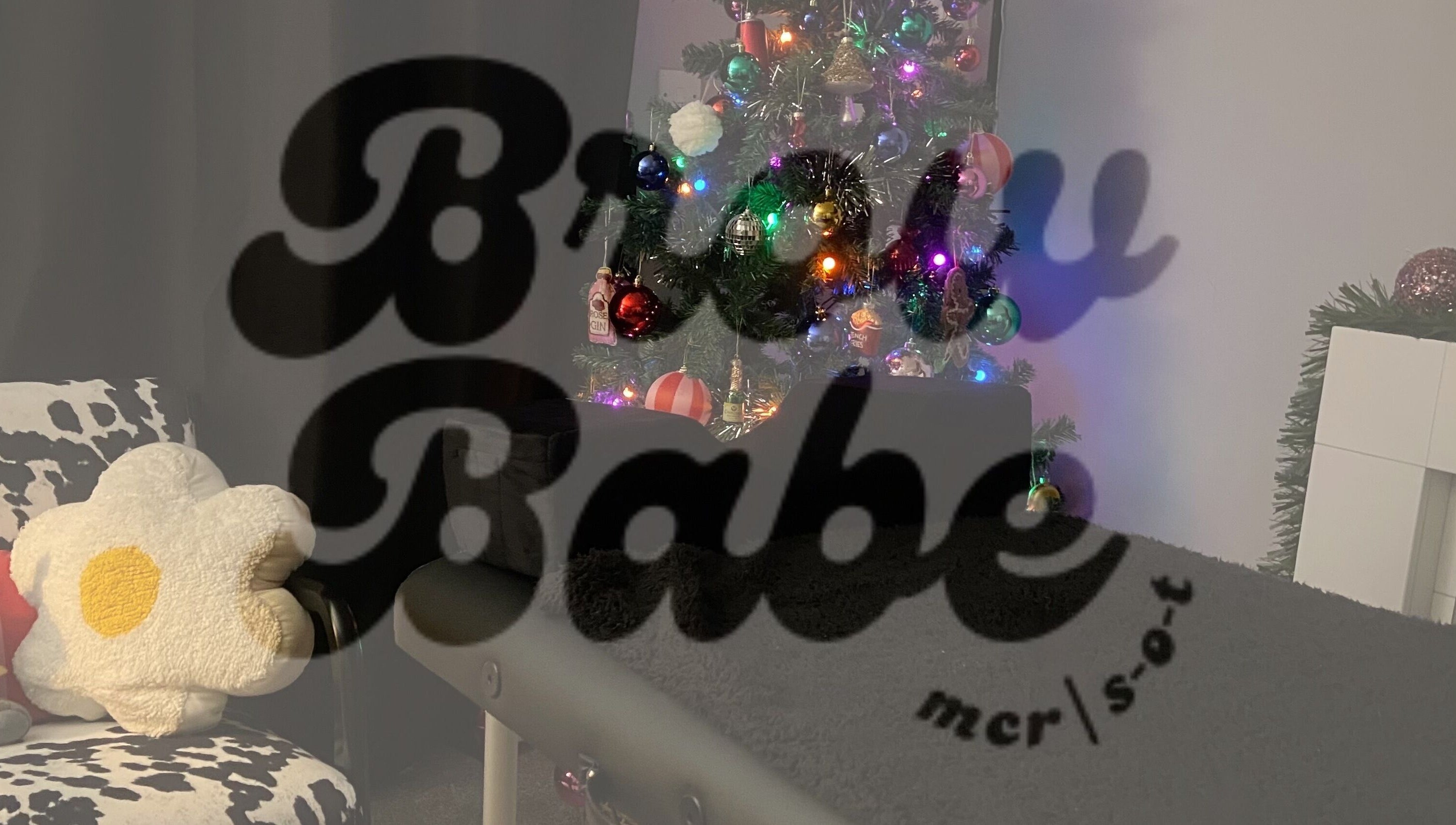 Festive nook at Brow Babe, Stoke-on-Trent, England, GB with holiday decor and cozy seating.