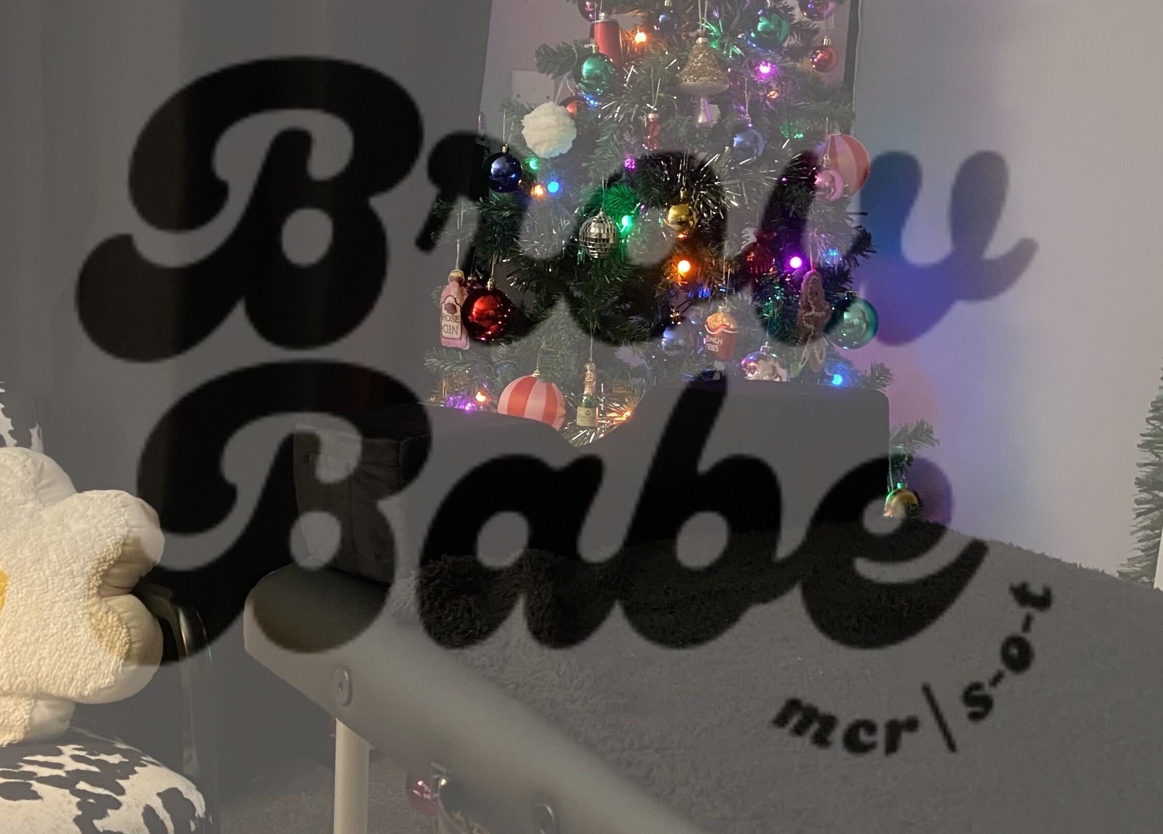 Festive nook at Brow Babe, Stoke-on-Trent, England, GB with holiday decor and cozy seating.