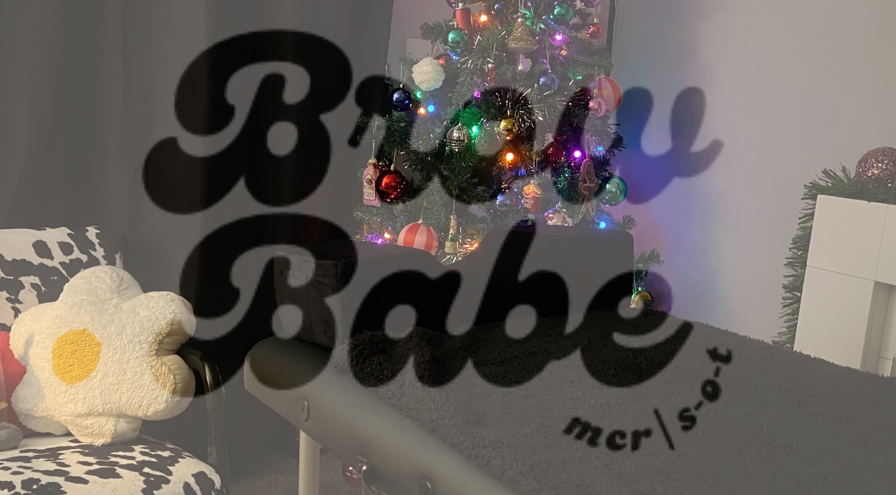 Festive nook at Brow Babe, Stoke-on-Trent, England, GB with holiday decor and cozy seating.