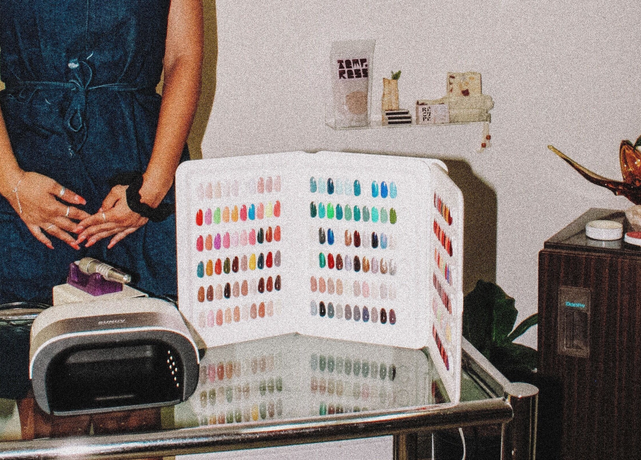 Nail polish color selection at Tempress Ongles, Montréal, Québec, CA, featuring a professional setup.