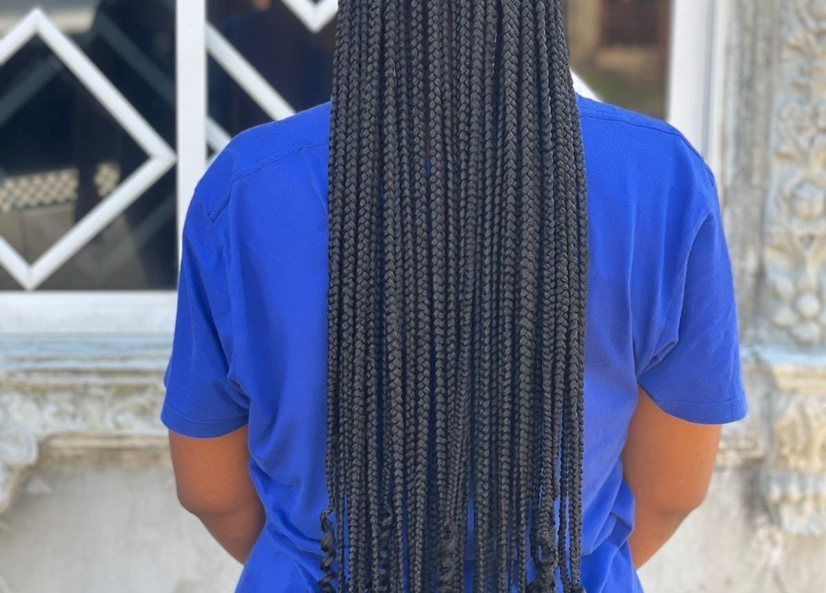 Elegant box braids by Braidsby_Sue, Montego Bay, St. James Parish, JM, showcased from the back.