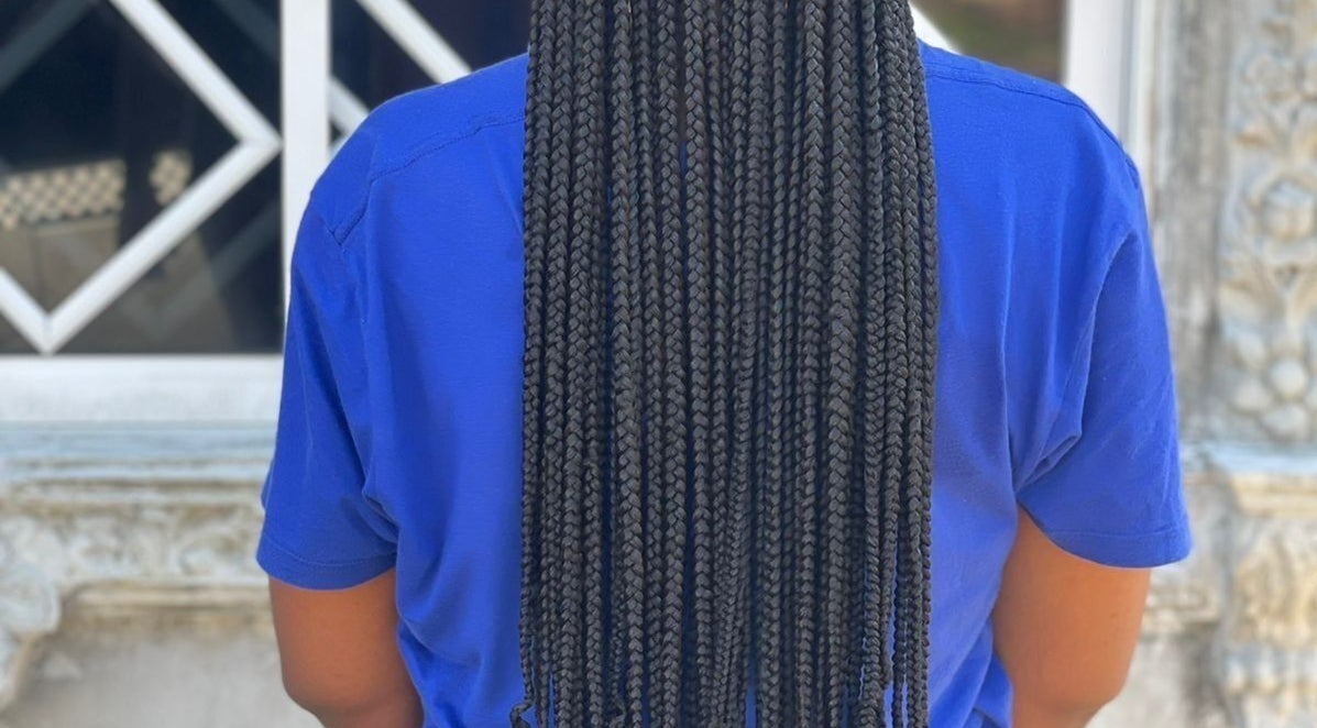 Elegant box braids by Braidsby_Sue, Montego Bay, St. James Parish, JM, showcased from the back.