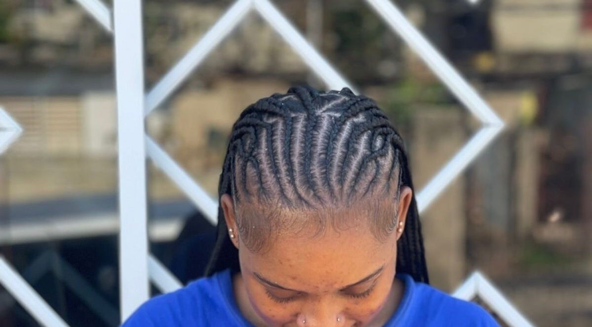 Intricate braided hairstyle by Braidsby Sue in Montego Bay, St. James Parish, JM.