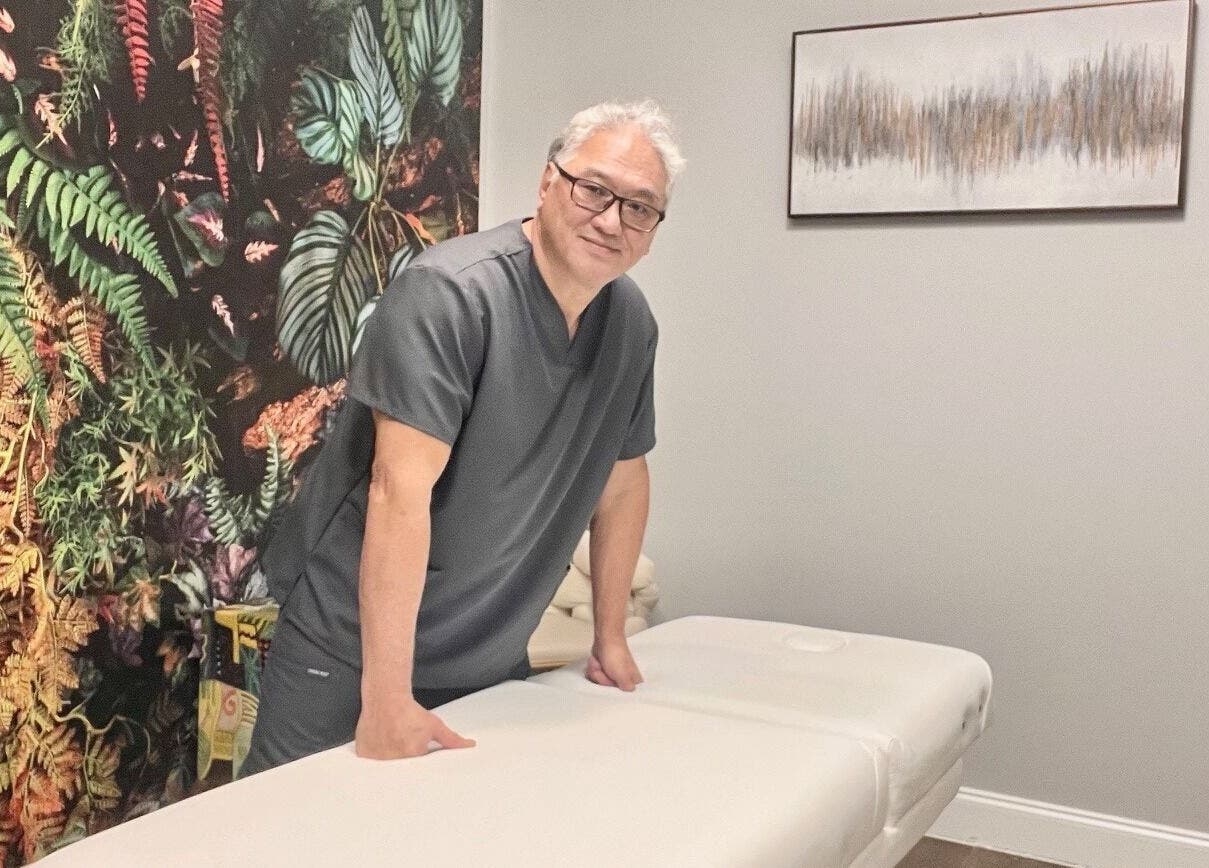 Massage therapist at THE REVIVE BAR in Allen, Texas, US ready to provide a relaxing experience.