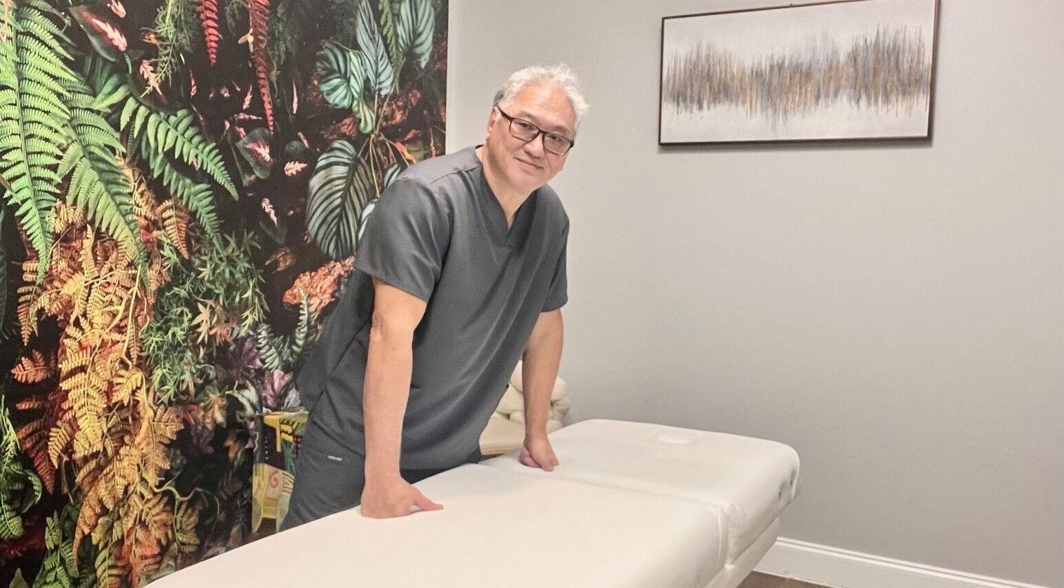 Massage therapist at THE REVIVE BAR in Allen, Texas, US ready to provide a relaxing experience.