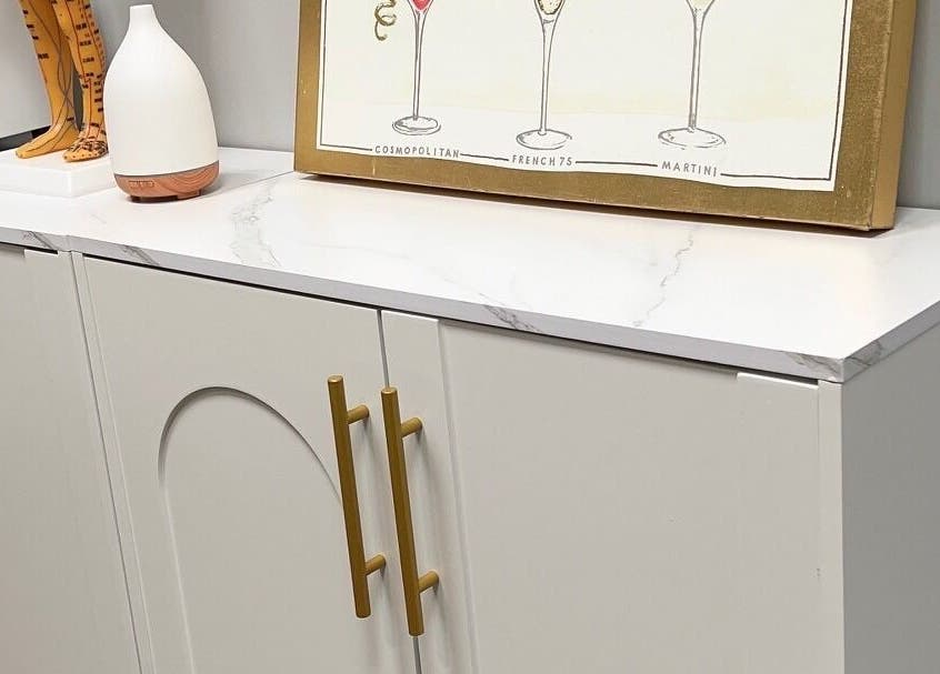 Elegant cabinet with decor at THE REVIVE BAR, Allen, Texas, US, showcasing modern design.