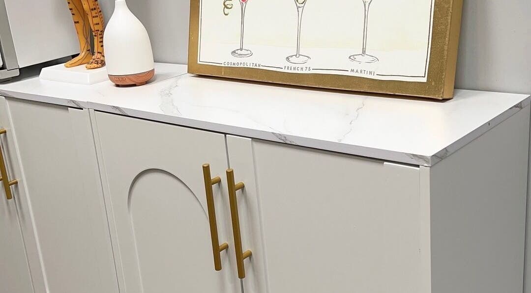 Elegant cabinet with decor at THE REVIVE BAR, Allen, Texas, US, showcasing modern design.