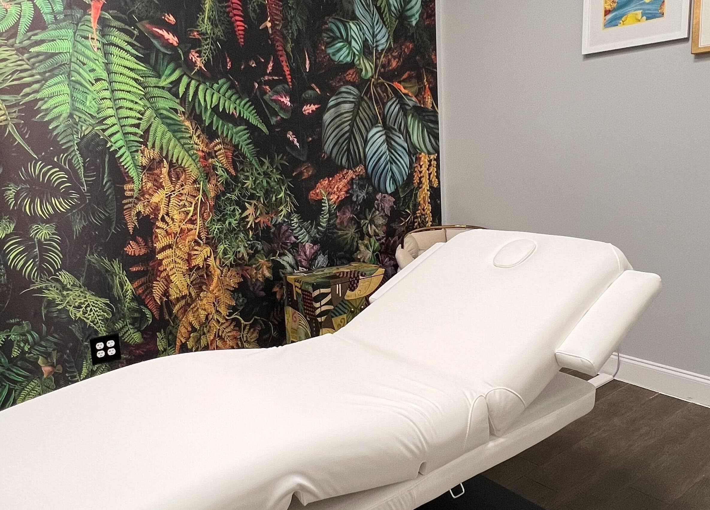 Relaxing massage room with jungle theme at THE REVIVE BAR, Allen, Texas, US.