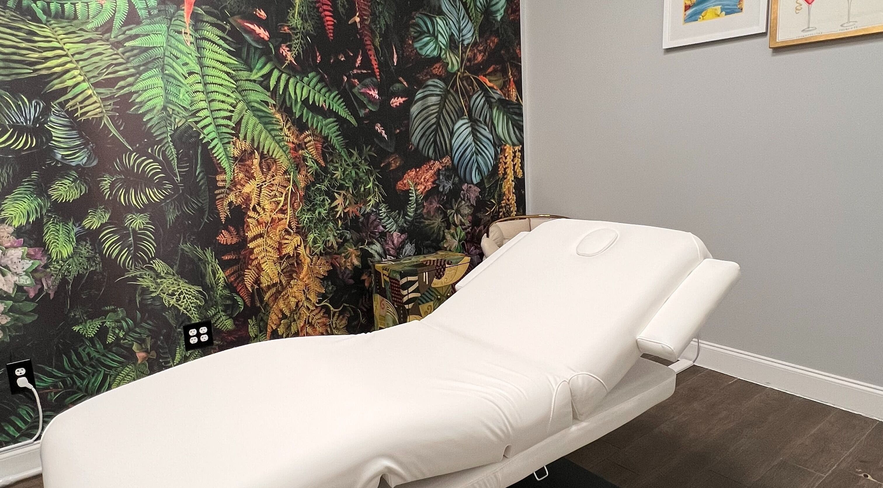Relaxing massage room with jungle theme at THE REVIVE BAR, Allen, Texas, US.