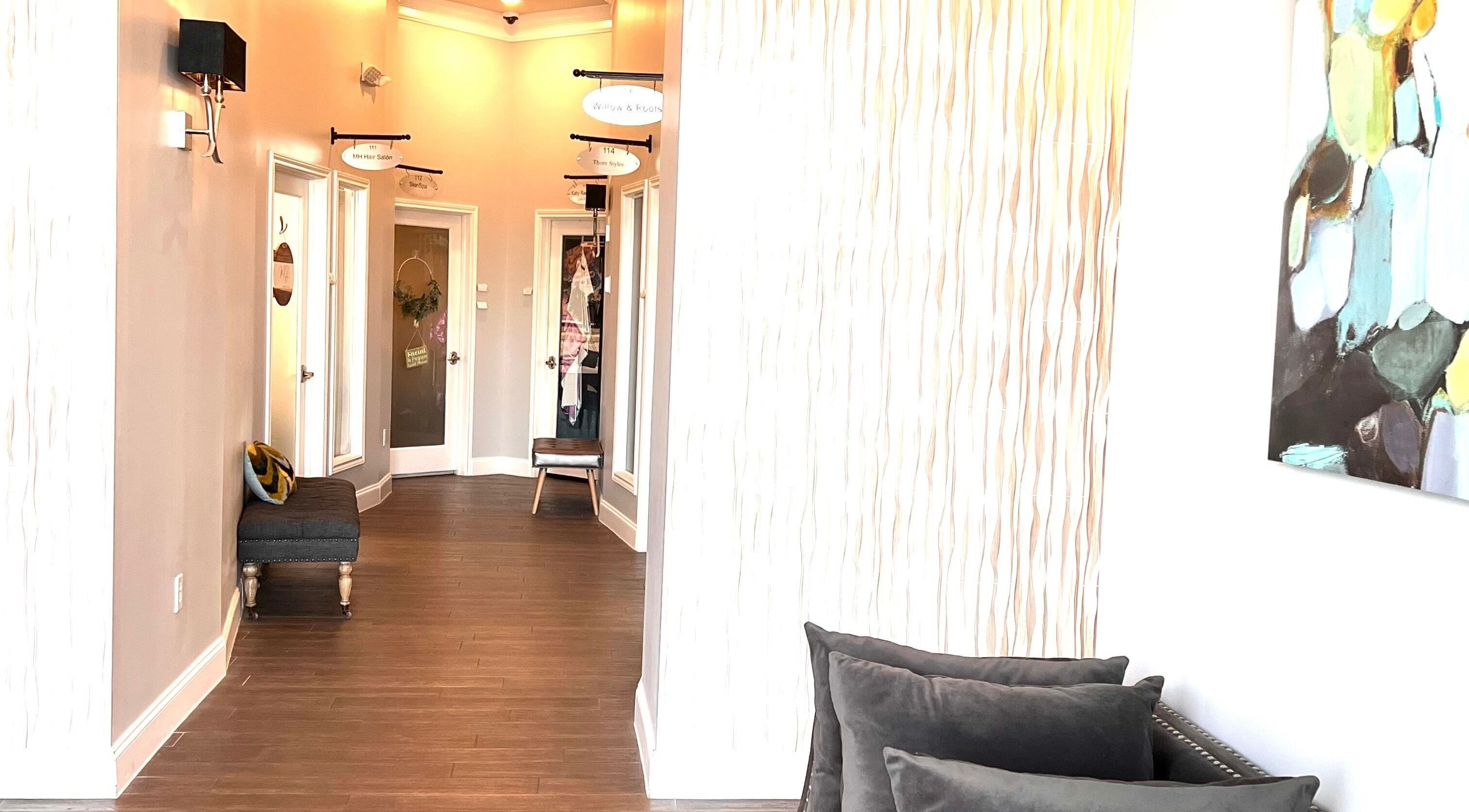 Elegant interior hallway of THE REVIVE BAR in Allen, Texas, US with chic décor and cozy seating.