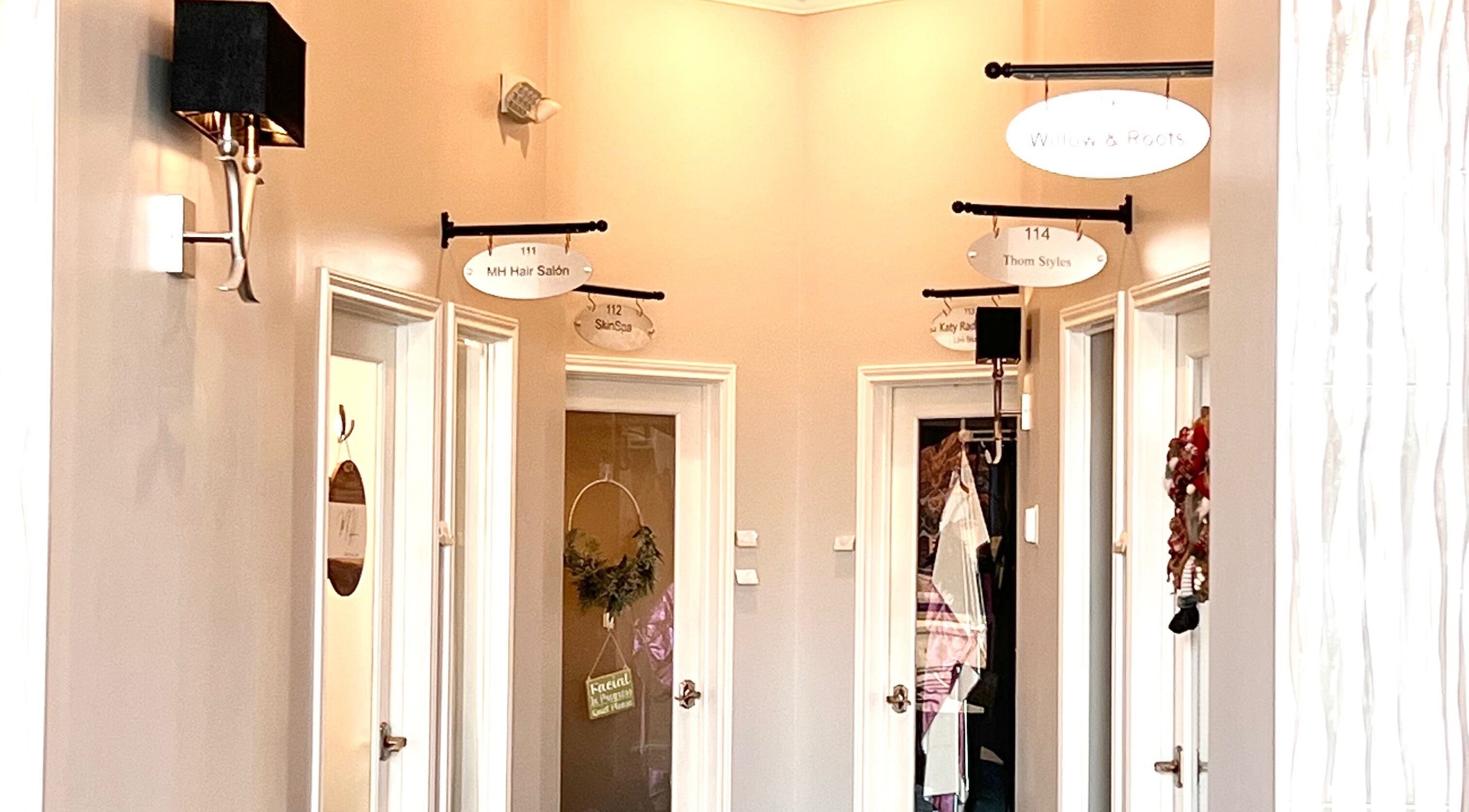 Interior corridor of THE REVIVE BAR with multiple salon entrances in Allen, Texas, US.