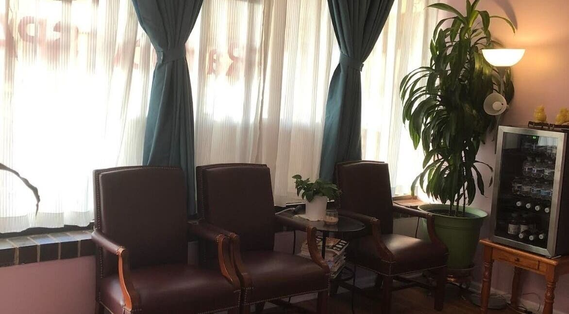 Elegant waiting area at Rainbow Spa, Schaumburg, Illinois, US with plush chairs and greenery.